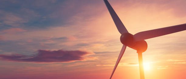 istock A wind turbine is seen against a beautiful sunset sky 2185861015