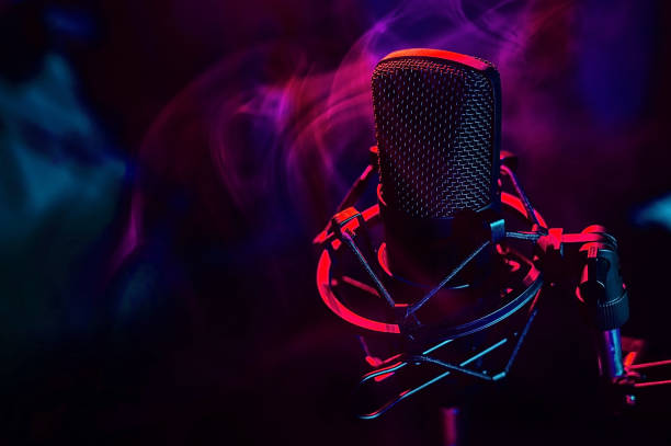 istock Professional microphone in red blue smoke on a black background. 2185861947