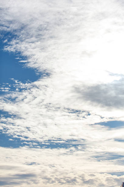 The sky is blue and cloudy. The clouds are white and fluffy