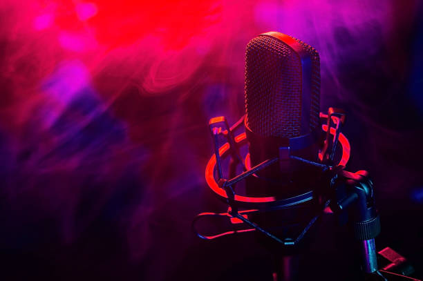 istock Professional microphone in red blue smoke on a black background. 2185864392