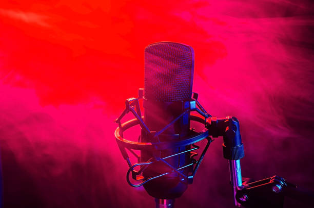 istock Professional microphone in red smoke on a black background. 2185865618