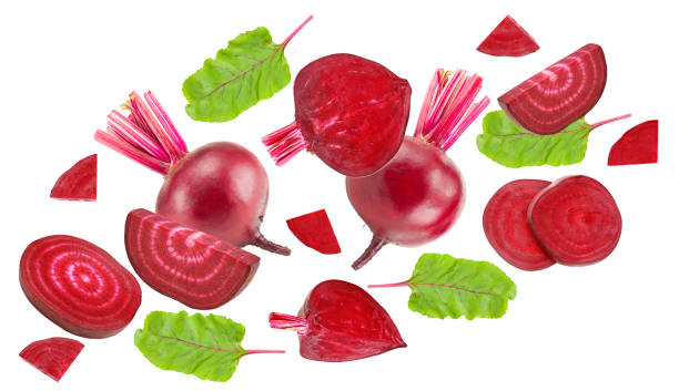 istock flying beetroot with pieces of beetroot and green leaf isolated on white background. clipping path 2185865942