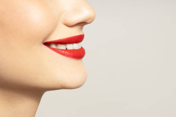 Lips of a young girl close-up on a light background