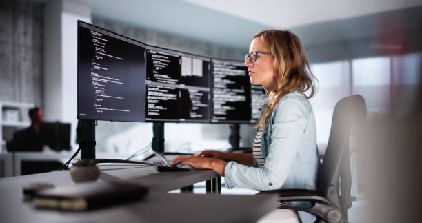 Software Programmer Or Coder Woman Software Programmer Or Coder Woman Using Office Computer debug stock pictures, royalty-free photos & images