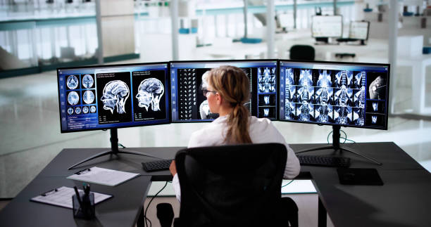 istock Doctors In Clinic Looking At Brain MRI Scan 2185872847