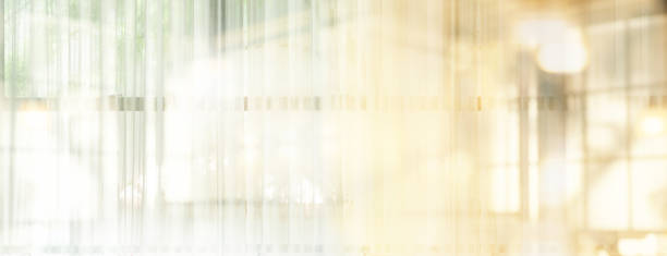 istock soft white curtain on the window interior banner background 2185873802
