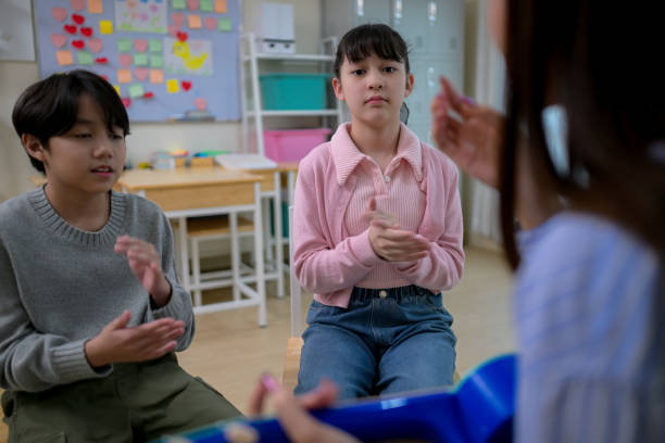 istock Ukelele Class, Teacher and students in music classroom 2185874033