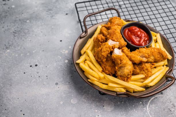 istock Deep fried chicken strips, stick from breast fillet. grey background. top view 2185878403