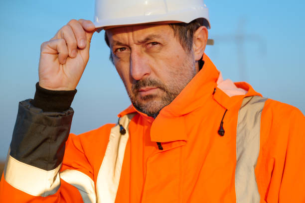istock Portrait of electrical engineer in field wearing high visibility jacket and white hard hat 2185880694