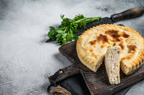 istock Sliced Kubdari, Tasty Georgian Flat Bread Stuffed with meat. White background. Top view. Copy space 2185880906