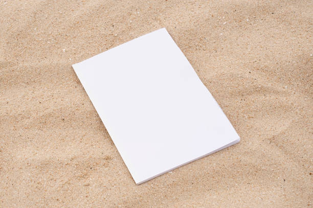 istock blank magazine mockup on sandy beach 2185885619