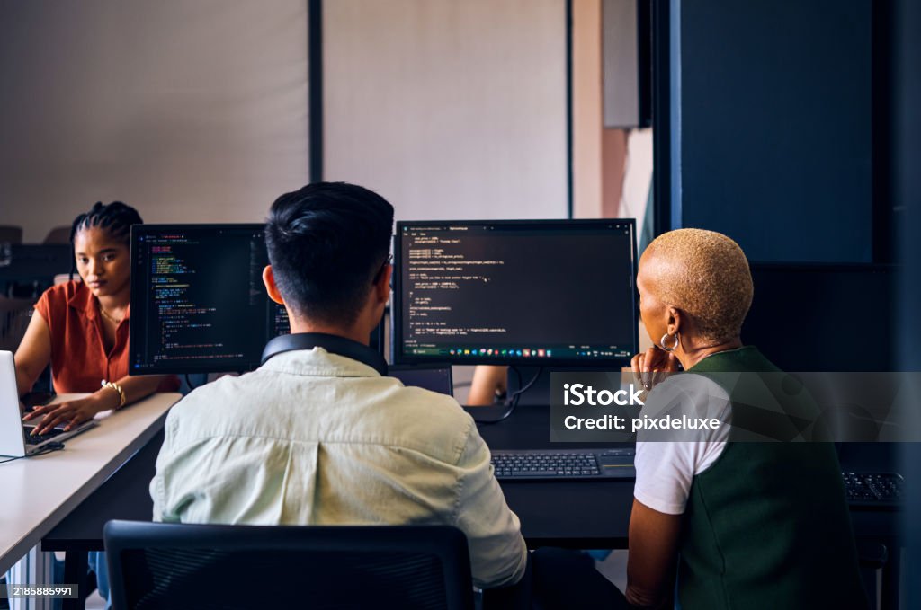 Focused Asian Computer Programmer Working On Code In Office Stock Photo ...