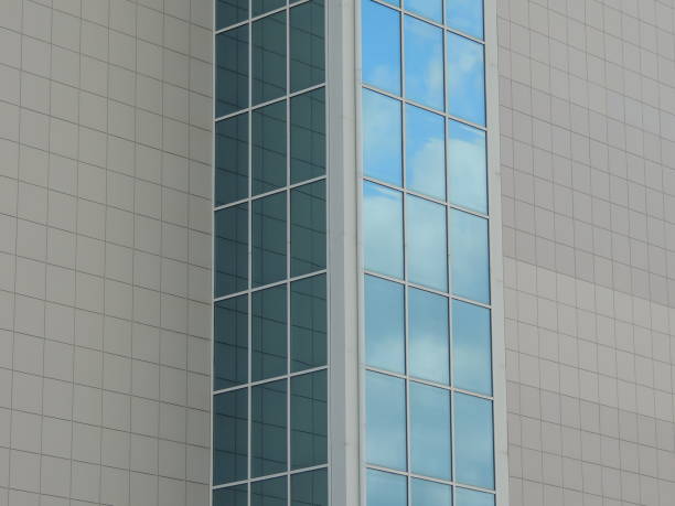 istock corner of a building with mirrored blue windows 2185886714