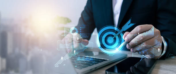 istock Businessman hand hold pen analyzing sustainability company growth target with digital virtual graphics, financial data for long term investment. 2185887799