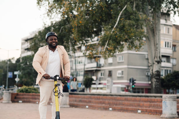 istock Businessman riding electric scooter in urban environment 2185888632