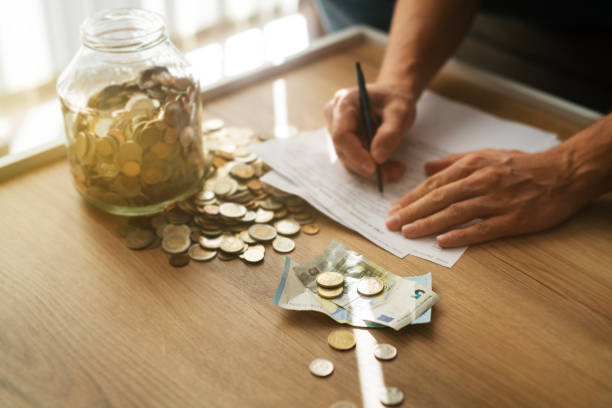 istock Using last money from piggy bank at home. 2185888734