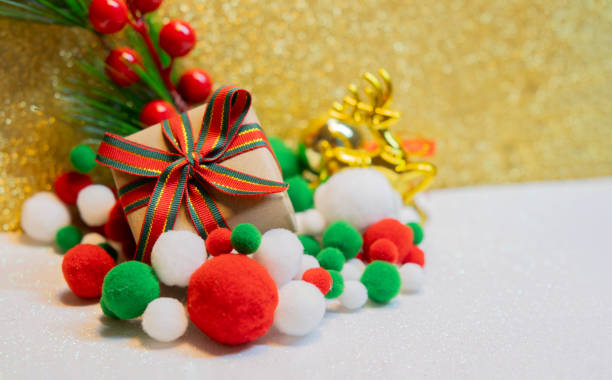 istock Side view of Christmas gift on white surface and Christmas decorations. 2185889712