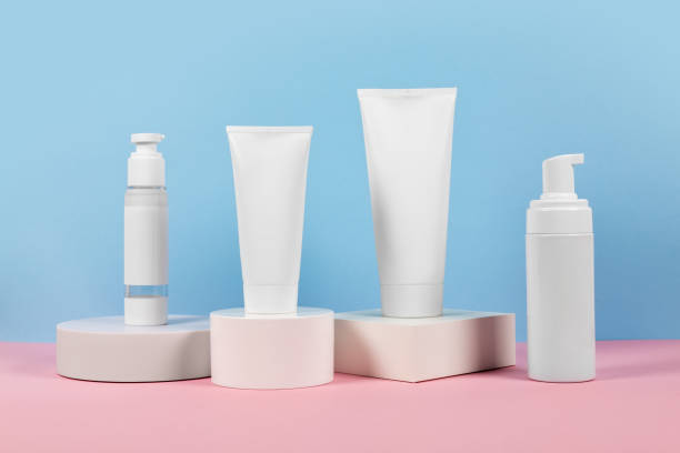 istock White plastic tubes without label displayed on podium. Scene for advertising cosmetics base 2185891104