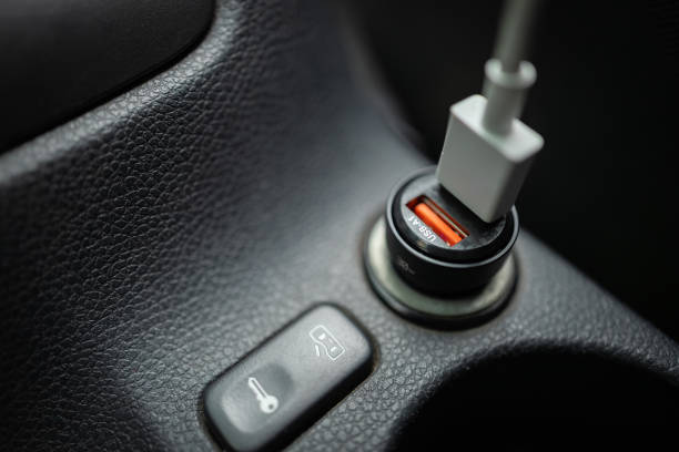 istock car charger for phone plugged into cigarette lighter 2185892800