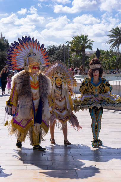 People in makeup and carnival costumes during Fat Tuesday at Mardi Gras carnival in Valletta, Malta People in makeup and carnival costumes during Fat Tuesday at Mardi Gras carnival in city: Valletta, Malta - February 23, 2020 mardi gras body painting stock pictures, royalty-free photos & images