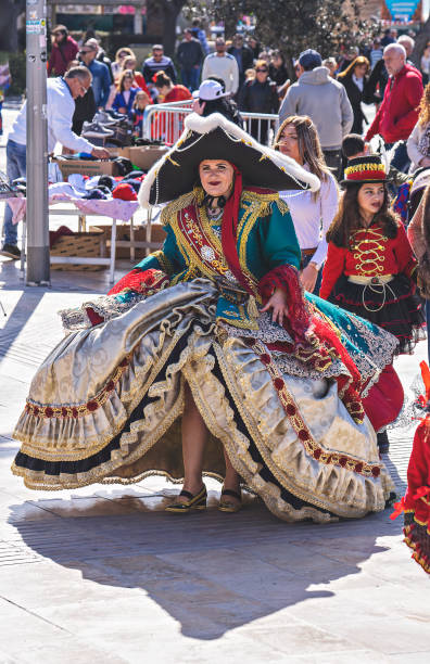 People in makeup and carnival costumes during Fat Tuesday at Mardi Gras carnival in Valletta, Malta People in makeup and carnival costumes during Fat Tuesday at Mardi Gras carnival in city: Valletta, Malta - February 23, 2020 mardi gras body painting stock pictures, royalty-free photos & images