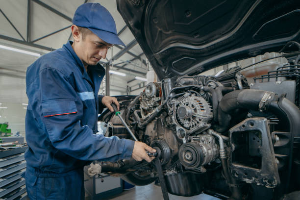 istock Auto mechanic repairs an engine. Replacing the timing chain 2185898113