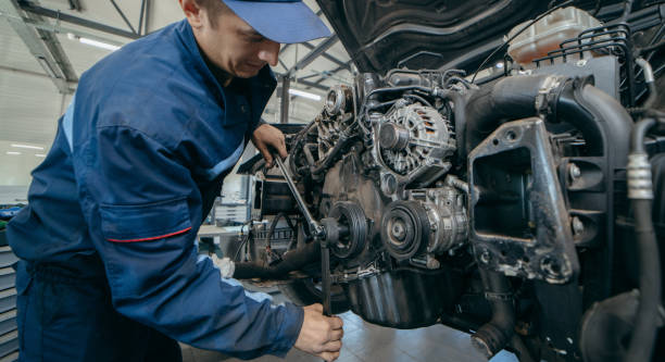 istock Auto mechanic repairs an engine. Replacing the timing chain 2185898118