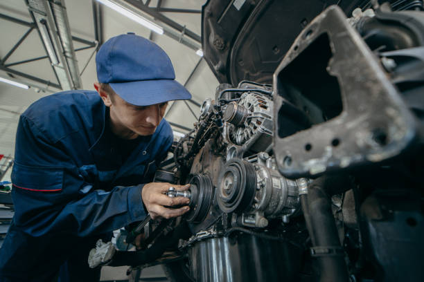 istock Auto mechanic repairs an engine. Replacing the timing chain 2185898133