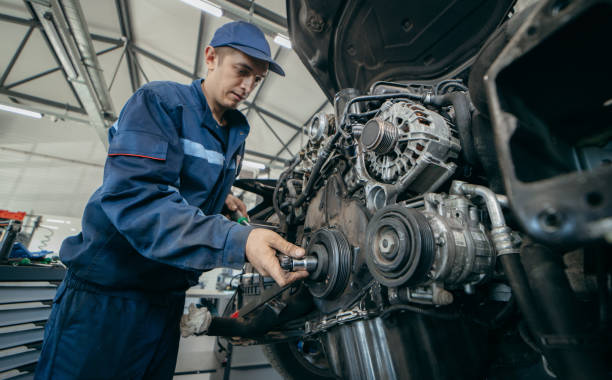 istock Auto mechanic repairs an engine. Replacing the timing chain 2185898150