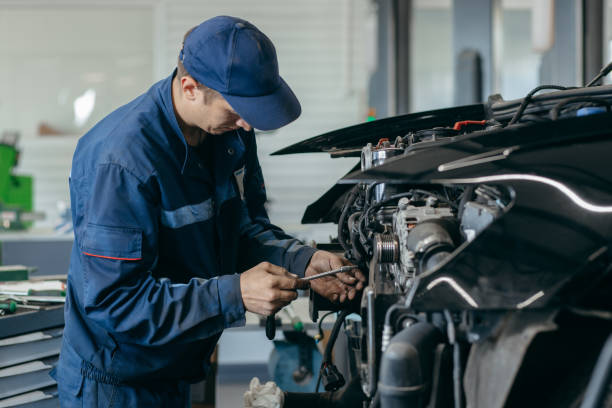istock Auto mechanic repairs an engine. Replacing the timing chain 2185898154