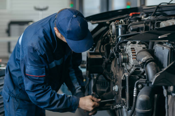 istock Auto mechanic repairs an engine. Replacing the timing chain 2185898171