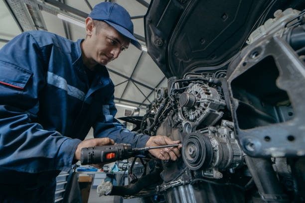 istock Auto mechanic repairs an engine. Replacing the timing chain 2185898204