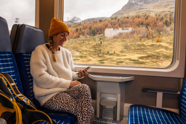 istock Woman Relaxing on Train with Scenic View 2185898408