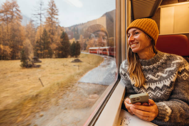 istock Happy Woman Enjoying Scenic Train Ride 2185898568