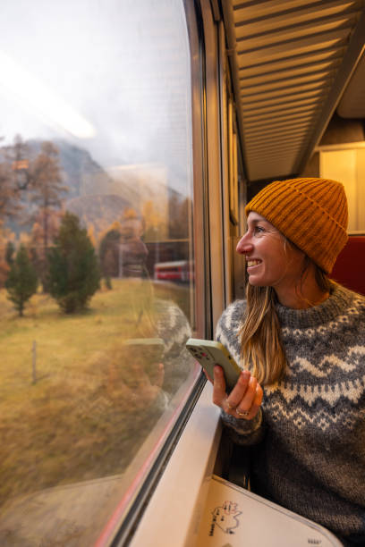 istock Happy Woman Enjoying Scenic Train Ride 2185898594