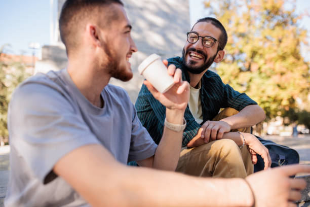 istock Male friends in the park 2185901497