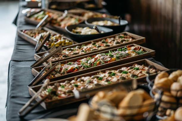 Catering Buffet With Fresh Appetizers In Wooden Serving Trays