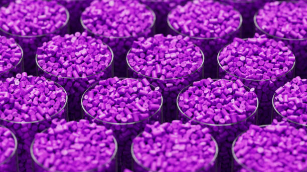 istock Grid of glasses filled with purple plastic polypropylene granules, masterbatch polymer grain, with shallow DOF. HDPE or PVC resin pellets. 3d render illustration 2185905455
