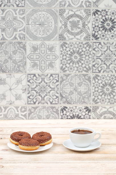 istock Enjoying Coffee and Donuts Placed Beautifully on a Rustic Table with a Decorative Background 2185906666