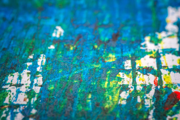 Extreme close up of colorful acrylic paint texture showing brush strokes. Selective focus.