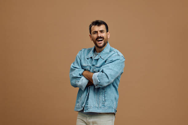 istock Studio shot of a man with arms crossed looking at camera. 2185909436