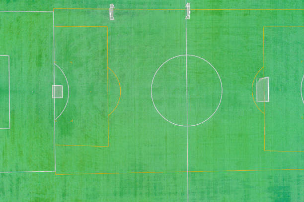 artificial grass soccer field after a training session, aerial top view with a drone