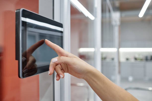 istock Hand of Woman Using Touch Screen Entering Access Code to Unlock Office Room Indoors 2185912360