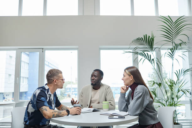 Businessman Discussing Project Details with Colleagues