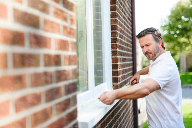 istock Man inspecting house window outside on day light 2185914838