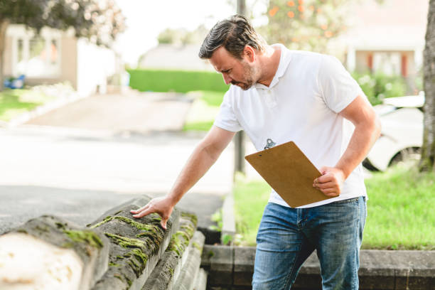 istock inspector or engineer is checking the building structure and house. After the renovate is complete 2185914855