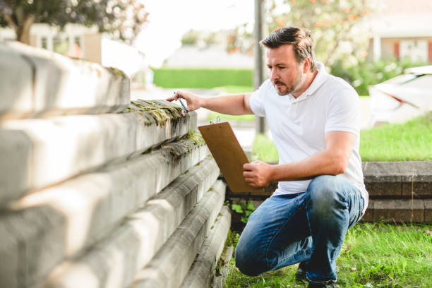 istock inspector or engineer is checking the building structure and house. After the renovate is complete 2185914872