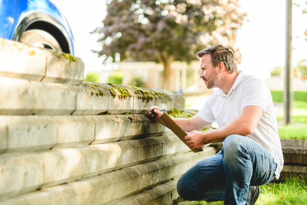 istock inspector or engineer is checking the building structure and house. After the renovate is complete 2185914873