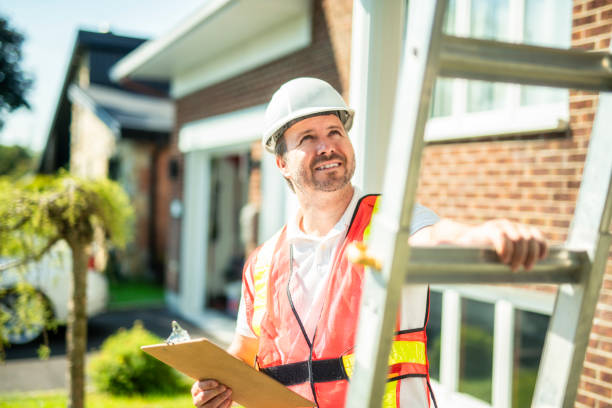 istock inspector or engineer with ladder checking the building structure and house roof specifications. 2185914921
