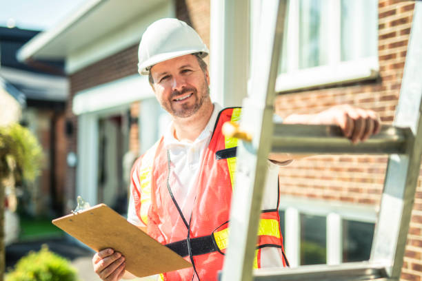istock inspector or engineer with ladder checking the building structure and house roof specifications. 2185914926